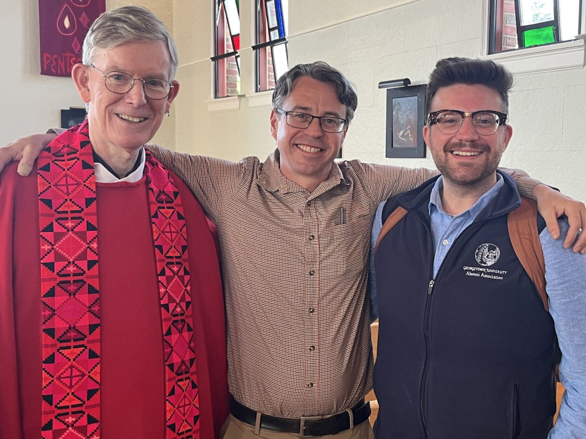 Fr. Phil Burrows, S.J., Georgetown’s inaugural VP of Mission & Ministry, with David Coffey (G’03) and Jarryd Delaney (SCS’24) at Club of Seattle event