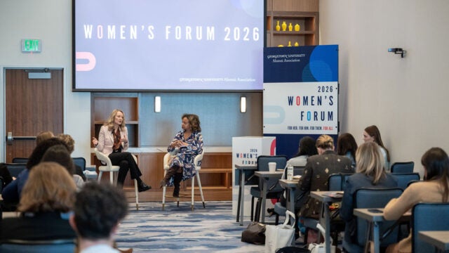 two people present in front of a classroom of people with the words 