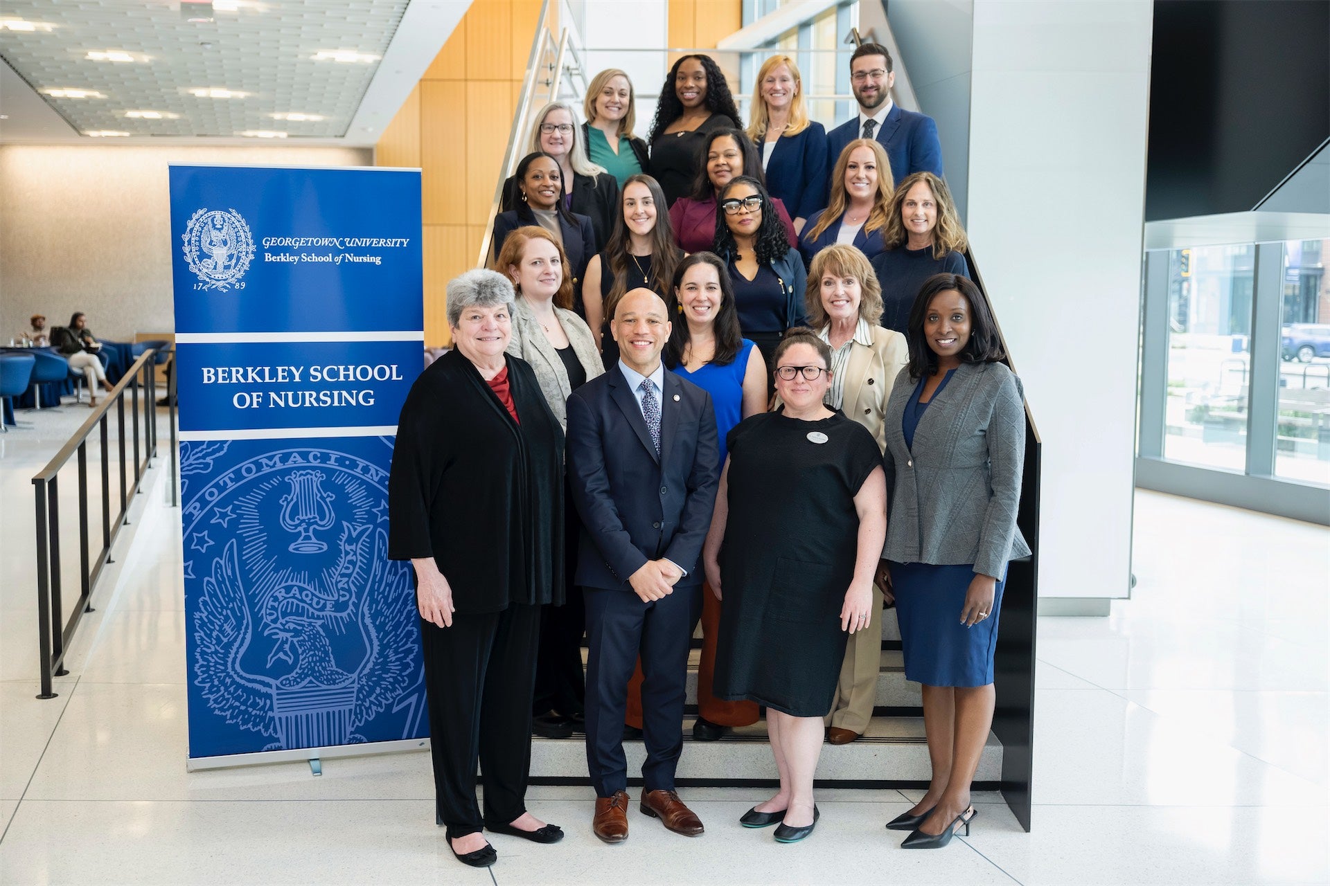 Associate Professor Stephan Davis (center) with students and faculty of the BSON’s Executive and Clinical DNP programs.