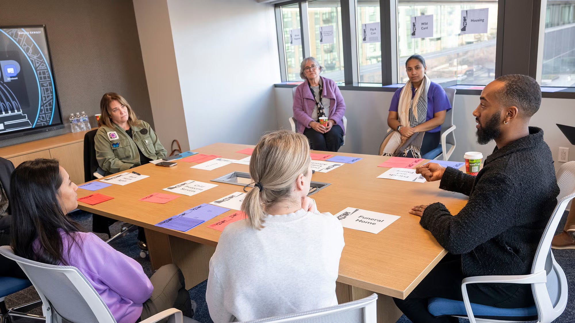 PMHNP leadership meets with cohort-mates Dristi Basnet (front left), Hilary Summers-Royce (G’13) (front center), and Tyris Ford (front right).