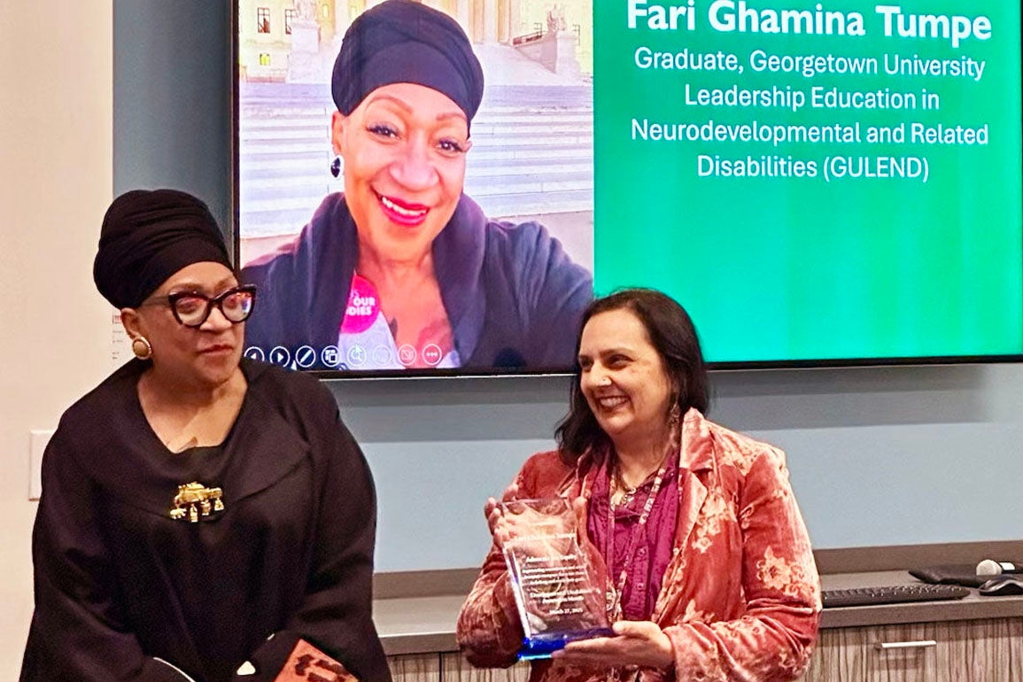 Fari Ghamina Tumpe getting an award