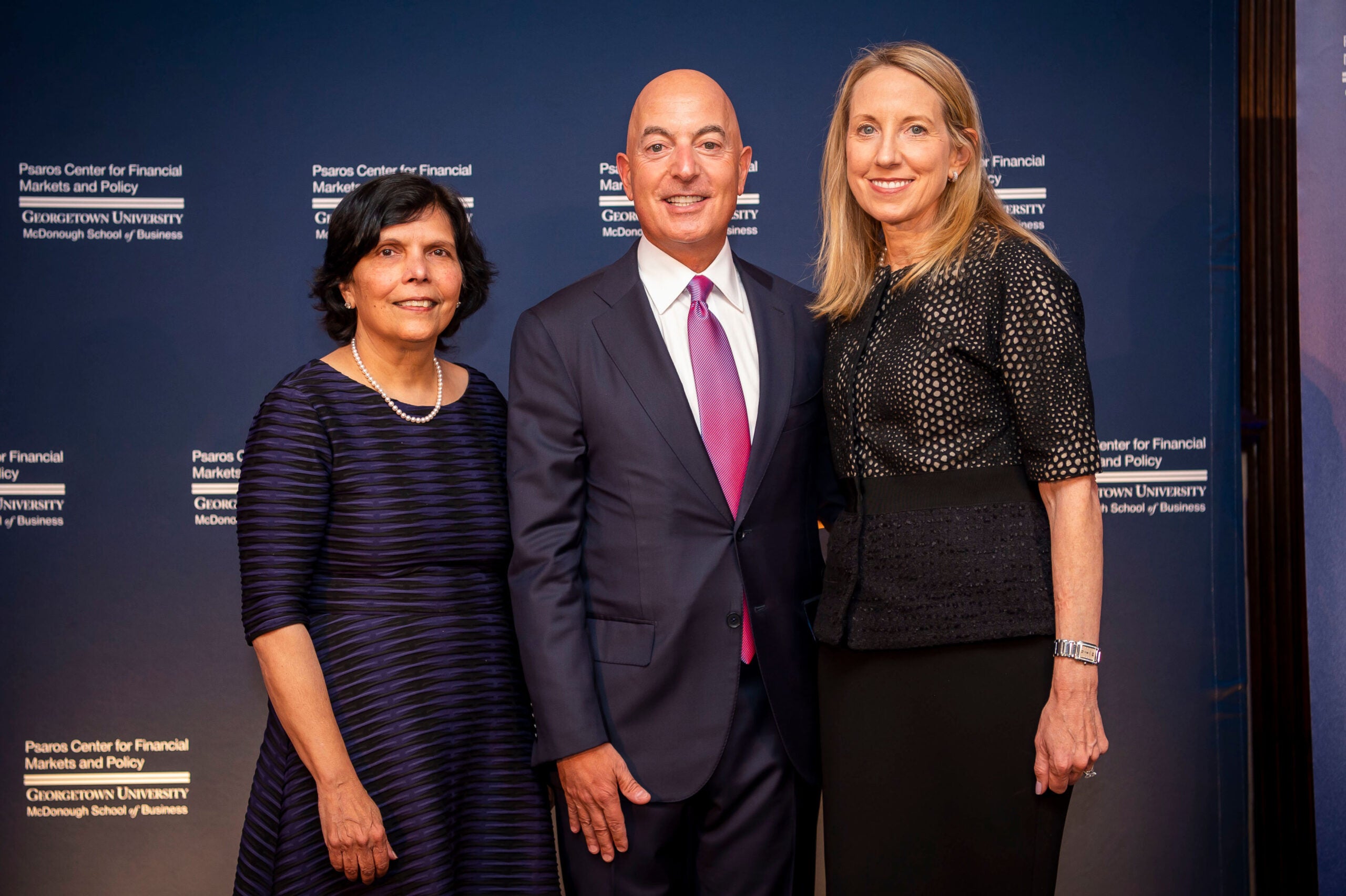 michael psaros and wife posing with reena aggarwal