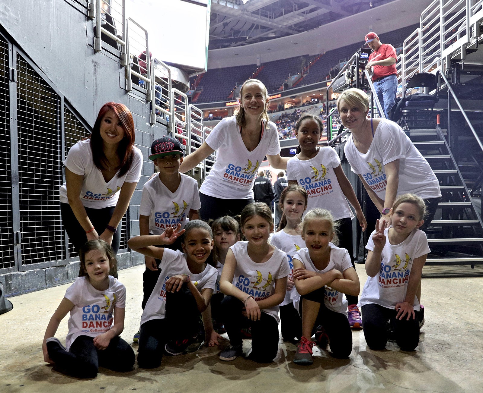 three instructors with Bananas Dancing’s hip hop and jazz students, ages 6-8,  at the Verizon Center in 2016