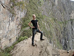 Jessica Robbins stands on the edge of a cliff