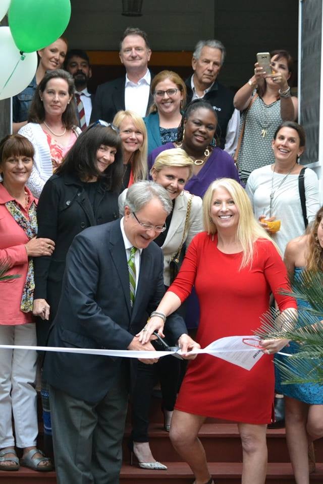 Mayor John Tecklenburg and Mackie Moore, both Georgetown alumni, cut the ribbon at the opening of THRIVE SC's first shelter. Photo courtesy of Mackie Moore.