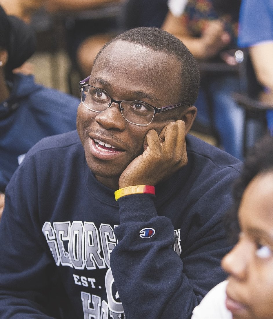 Syed Chapman, one of the 75 incoming Community Scholars, listens intently in the “Transition to College” session.
